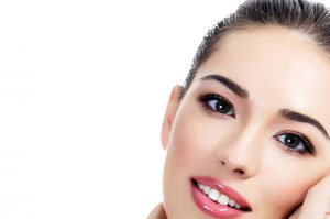 Beautiful girl with clean fresh skin, white background